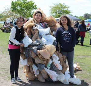 Bayside Middle School students Paola Contieres, Alan Aguilar and Maleah Huff take a moment to smile for the camera while educating Earth Day attendees about the pitfalls of plastic bags. 