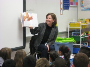 Elena Momich is reading poetry to two third grade classes.