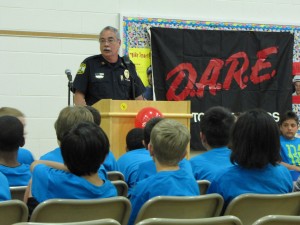 Captain Santos, addressed New Castle Elementary School fourth graders at their D.A.R.E. Graduation . 