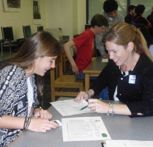 Freshman Lauren Smith and Amy Courtwright, from VBSFCU, make financial plans.