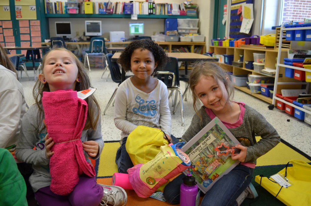 Morrigan Machese, Valencia Stephenson and Naomi Swetland check out their new bags.