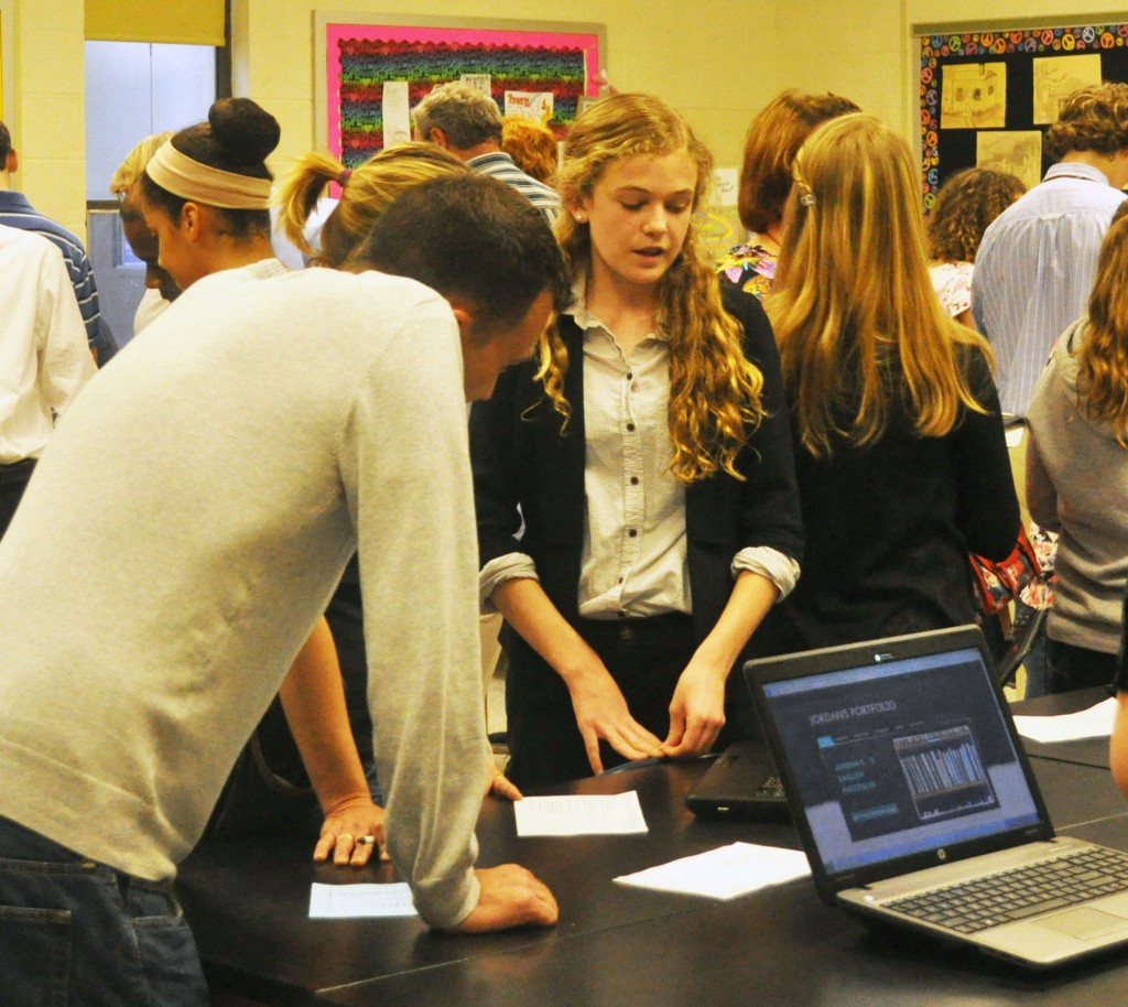 Independence eighth-grader, Emma Hogan discusses her writing with guests. 