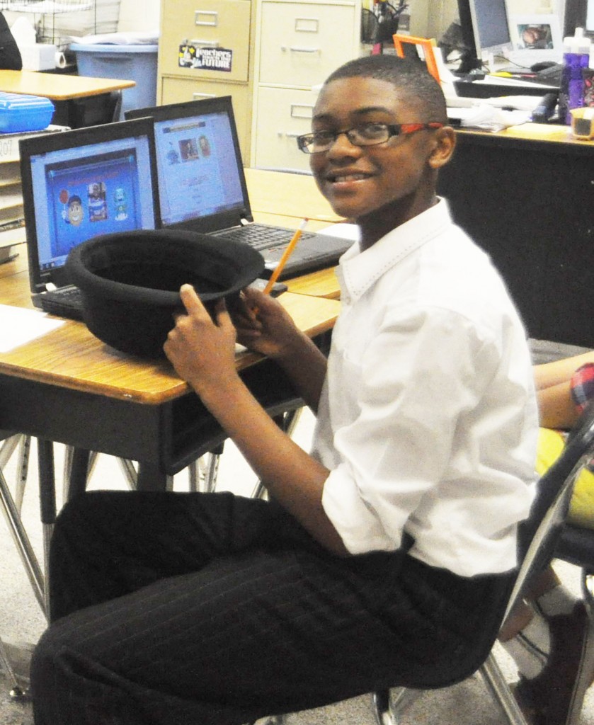 Quinston Pugh, a seventh-grader, prepares to present his digital writing portfolio.