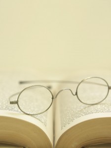 Eyeglasses on Open Book