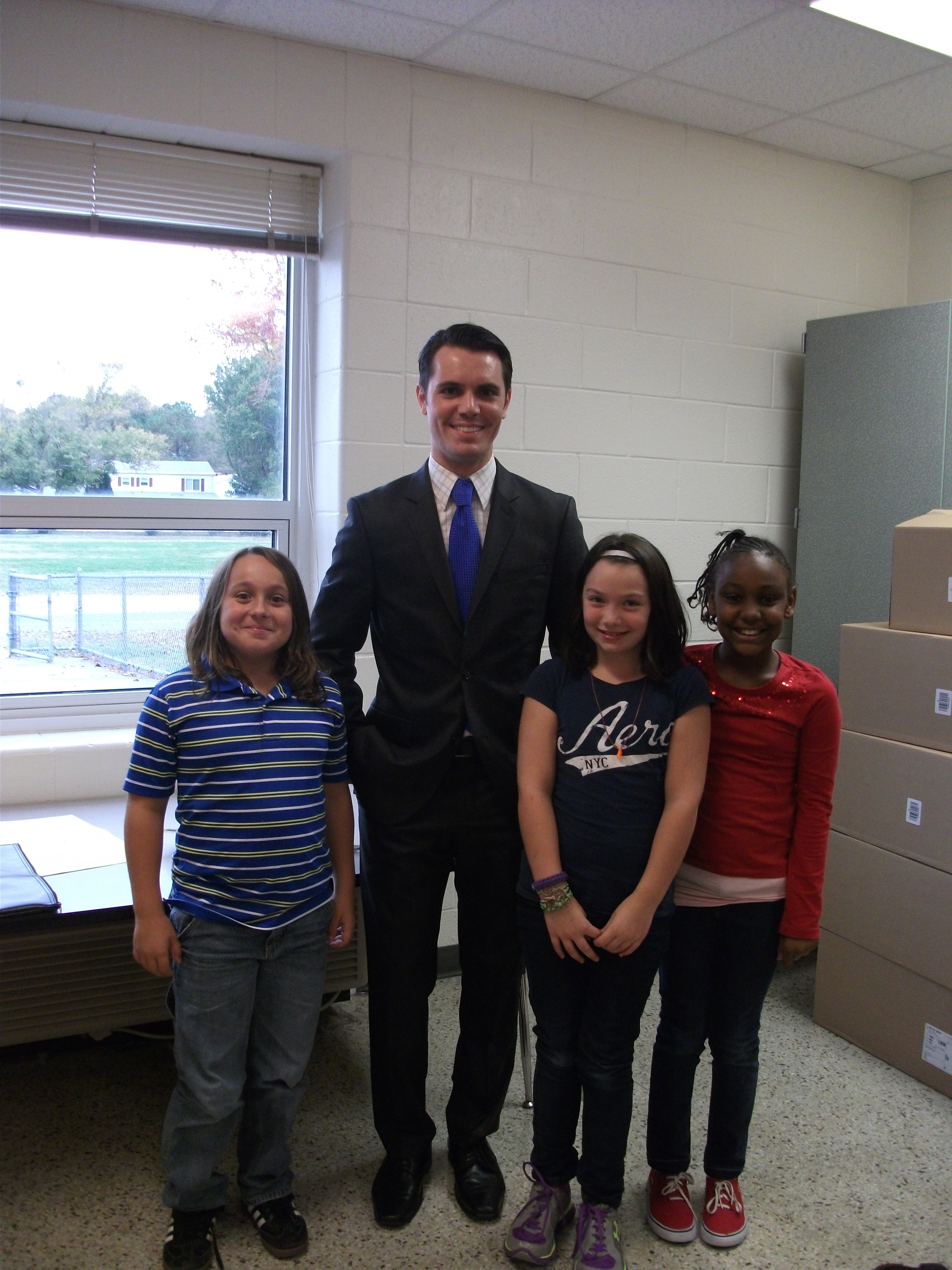 Luxford Elementary fourth-graders recently hosted meteorologist,Myles Henderson from WTKR-TV. He shared with the students various tools he uses in order to create a weather forecast. Students were given the opportunity to share their knowledge on the types of weather associated with pressure systems.  Pictured here from left to right are Kyle Holcomb, meteorologist Myles Henderson, Avery Morrison and Iyanna Turner. 