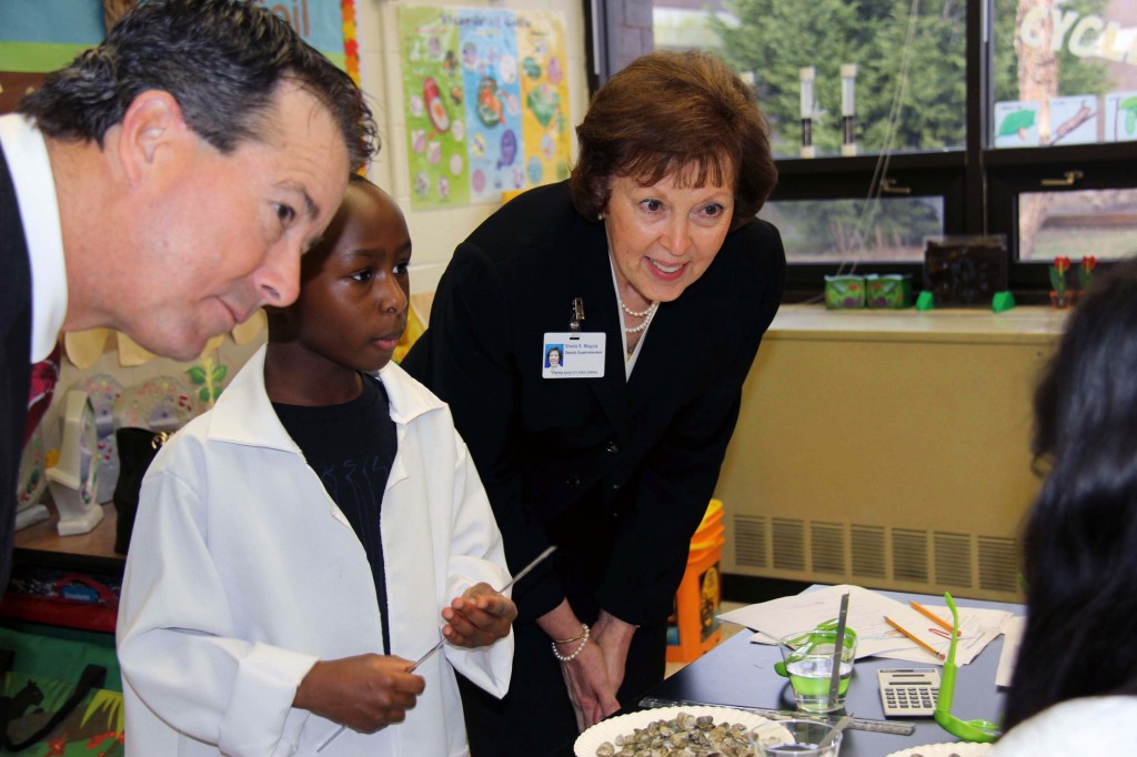VBEF President Nelson Adcock and VBCPS Deputy Superintendent Sheila Magula observe a Tallwood student in the science lab. 