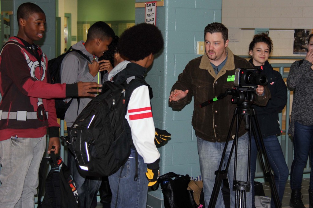 Students in the Women of Valor/Men of Integrity group prepare a scene for the anti-bullying video they wrote.