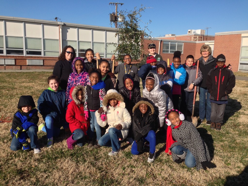 Fourth-graders at Williams Elementary as well as fourth grade teacher Lisa Riley and Gifted Resource Teacher Julie Hayden celebrate after the live oak was planted.