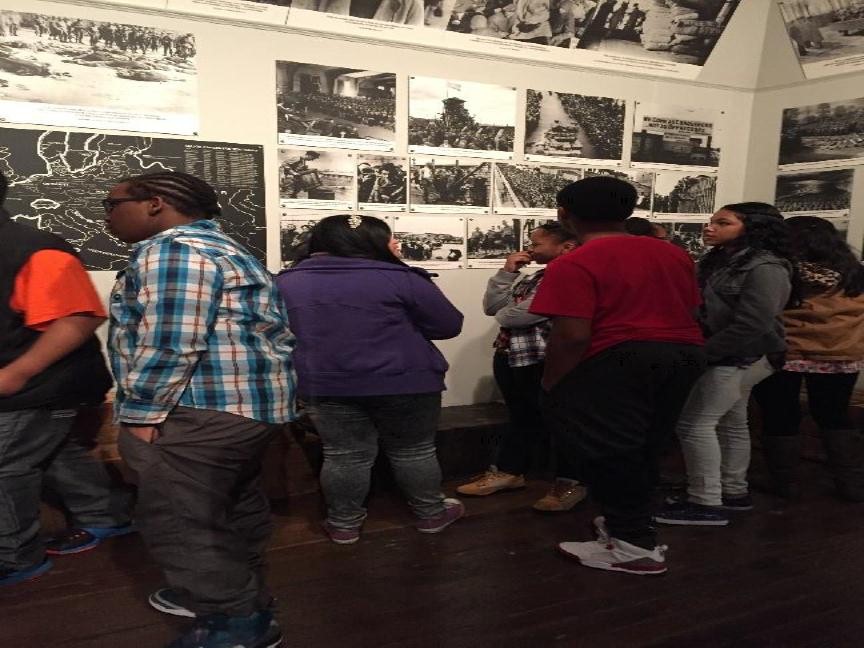 Bayside Middle students take a closer look at the photographs of Hitler’s rise to power during WW II.