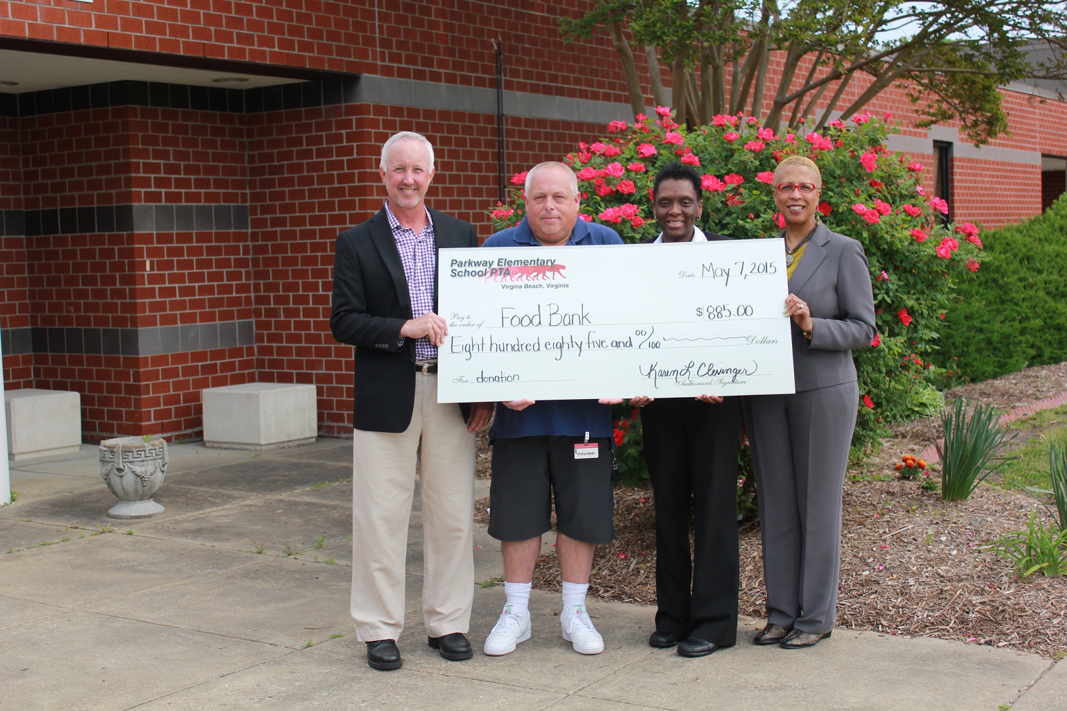 Pictured left to right are Scott Richards, Foodbank of Southestern Virginia, Scott Kell, PTA President, Felicia Mayo, the Cheesecake Factory and Parkway Principal Toni Diggs.