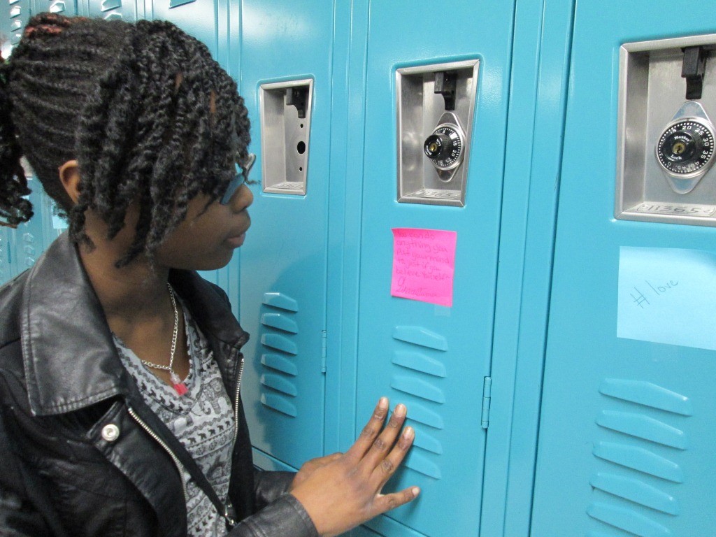 Seventh-grader Kelise Batt reads the note left on her locker.