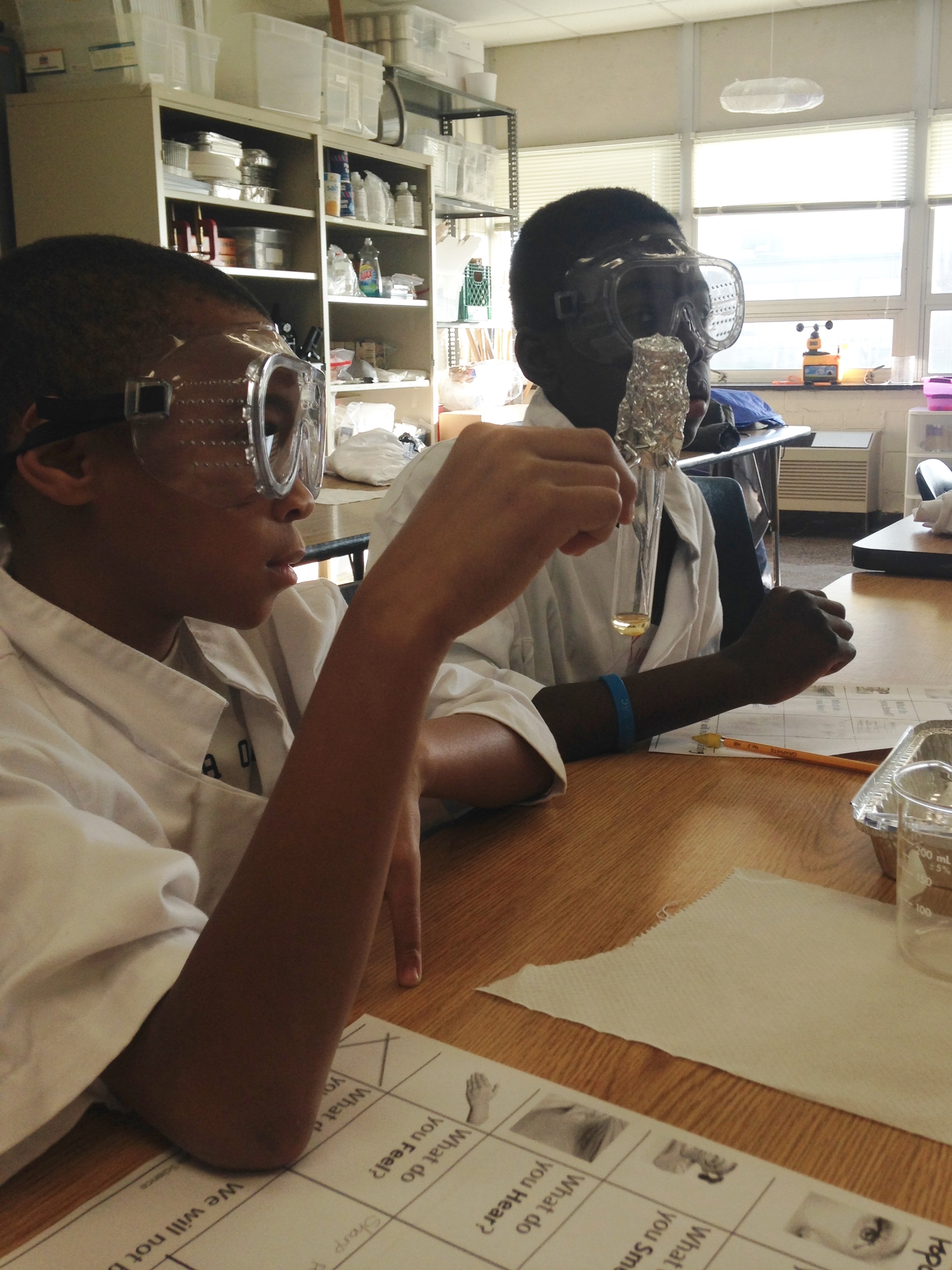 Reginald Thompson and Kion Saunders work together while in the popcorn lab. 