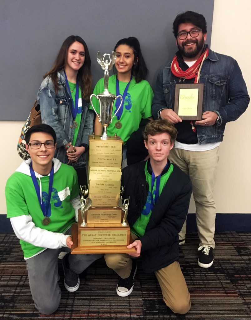 ATC students show trophy that they won at the Great Computer Challenge